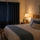 Bedroom with blackout curtains and soft evening lighting for better sleep